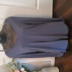 womens long sleeve blouse. Med blue cove in color and open at the shoulders.